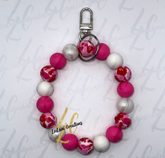Handmade pink and red heart print beaded wristlet keychain with hot pink and pearlescent white silicone beads and silver lobster claw clasp