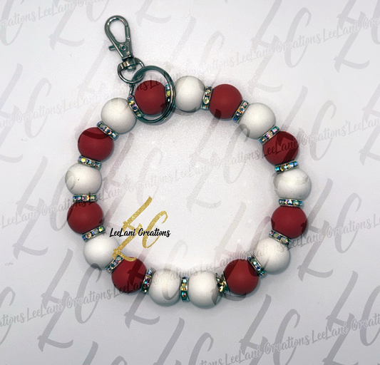 Beaded keychain with red and white beads on a light gray background with 'LeelaLani Creations' branding.
